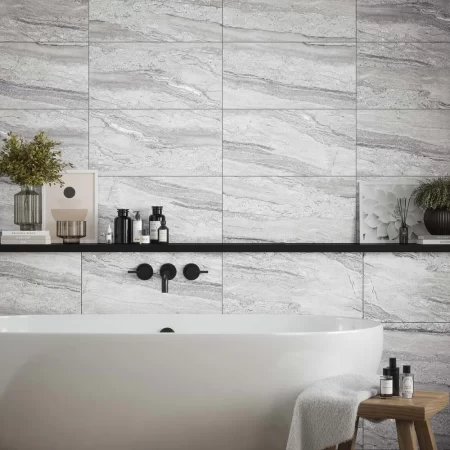 laurent grey matt is a travertine effect wall tile that is 300x600mm, this is tiled on a bathroom wall. p12879