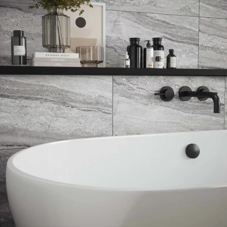 laurent grey matt is a travertine effect wall tile that is 300x600mm, this is tiled on a bathroom wall. p12879