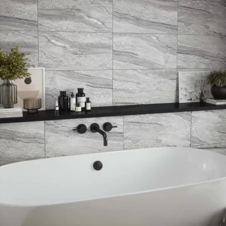 laurent grey matt is a travertine effect wall tile that is 300x600mm, this is tiled on a bathroom wall. p12879