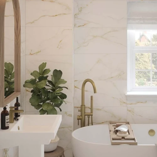 an image of bathroom tiles with a gold and white pattern.