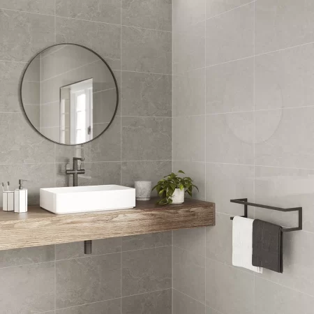 an image of zeta silver gloss and zera dove gloss ceramic wall tiles in a bathroom, these tiles have a rectified square edge and are 300x450mm in size.