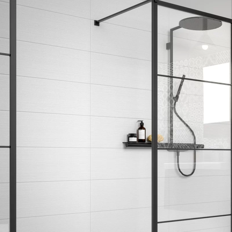 essenziale linee bianco 250x750mm tiles in a shower.