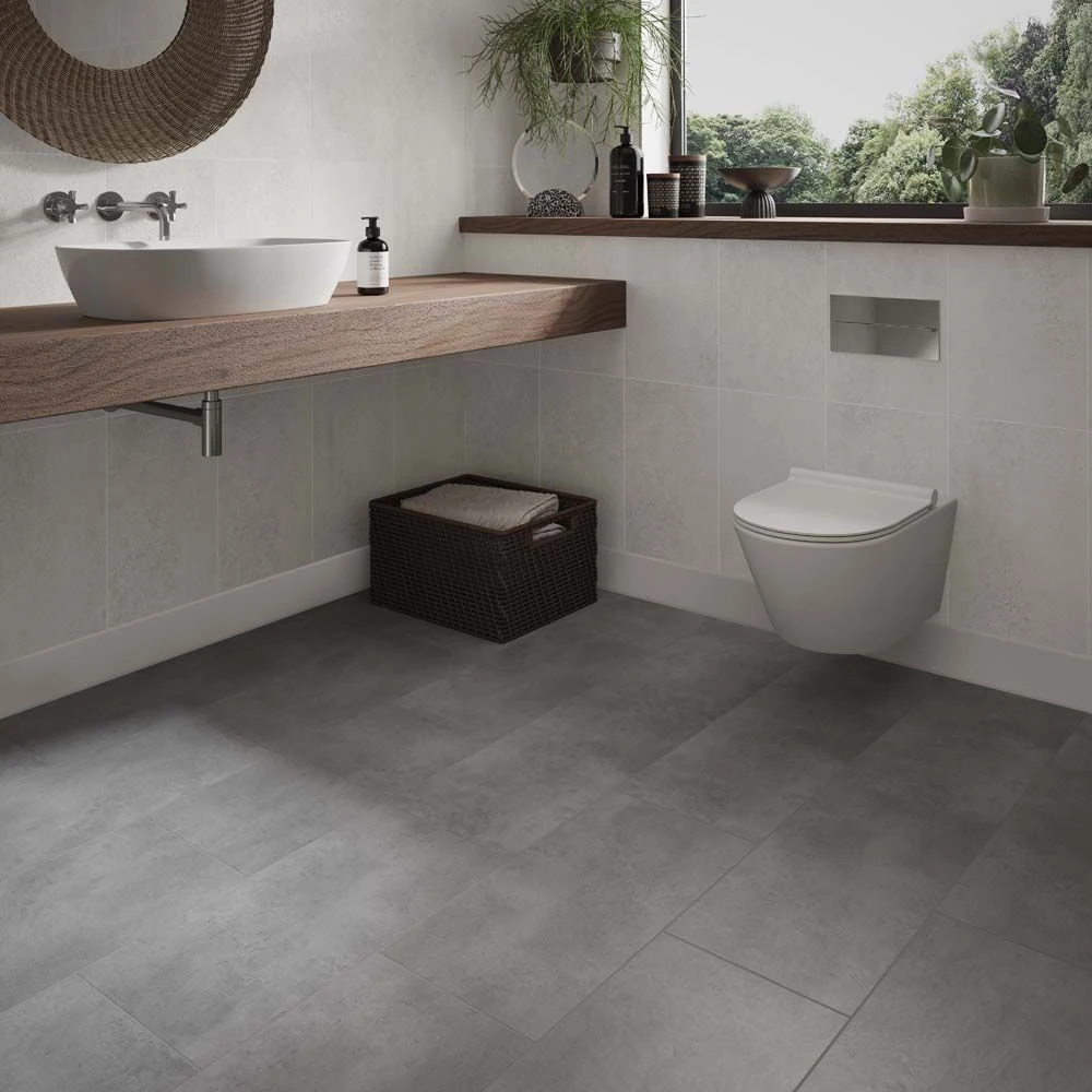 an image of pinnacle concrete grey lvt click floor in a bathroom