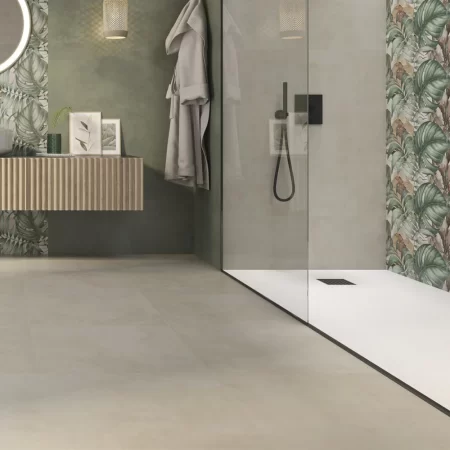 Contemporary bathroom with shower area featuring Eleganza Beige 333x1000mm wall tiles, complemented by botanical decor tiles and modern fittings.