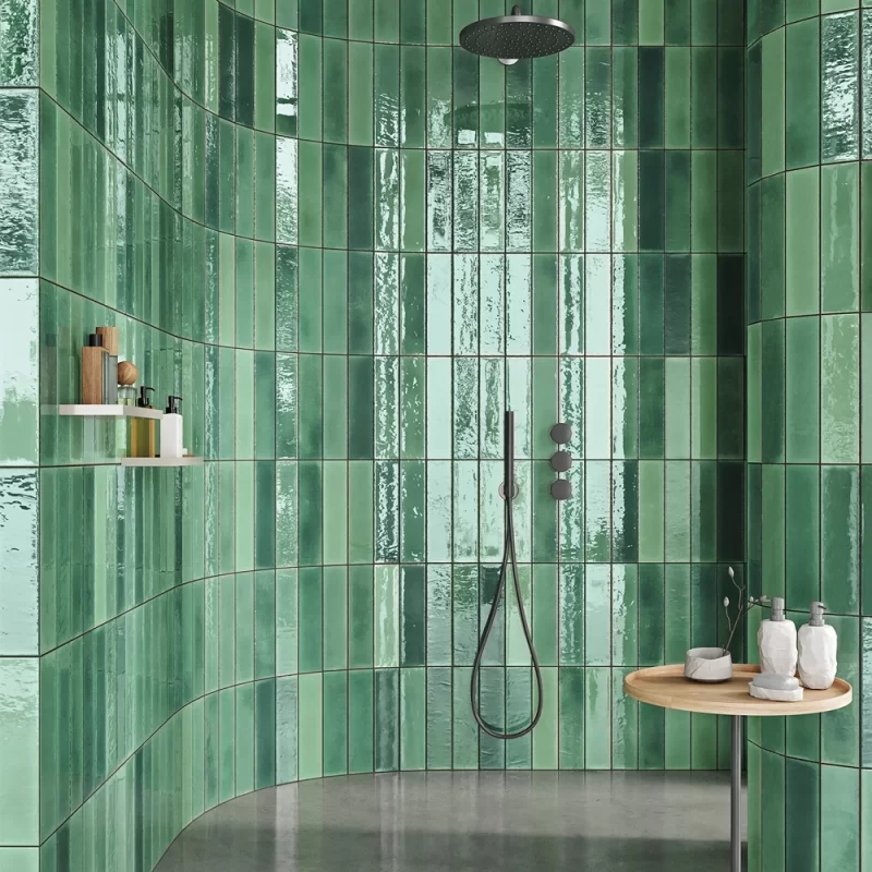alcanar green wall tiles by mayolica, tiles in a bathroom on the wall in soldier style.
