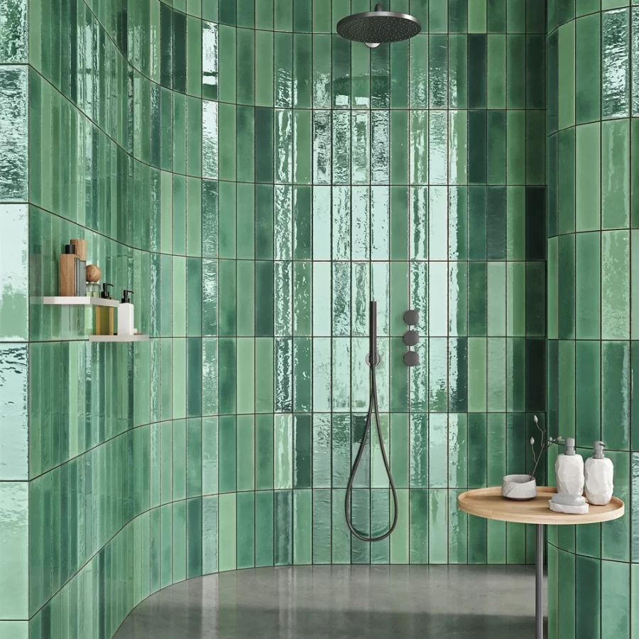 alcanar green wall tiles by mayolica, tiles in a bathroom on the wall in soldier style.