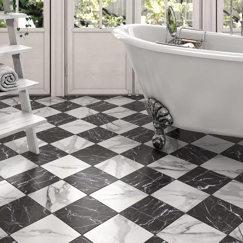 classic marble chequered floor tiles on a bathroom floor with a classic style roll top bath.